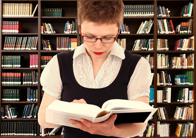 Woman holding book with head excessively downward
