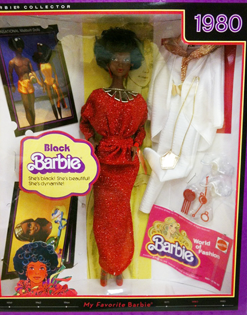 Black Barbie doll with outfits, in box, from 1980.