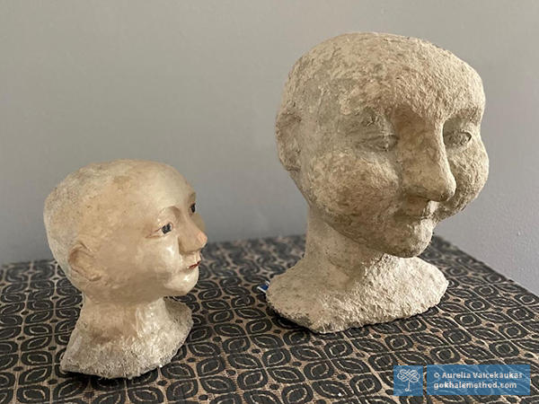 Two paper-mache dolls heads fashioned by Aurelia Vaicekaukas