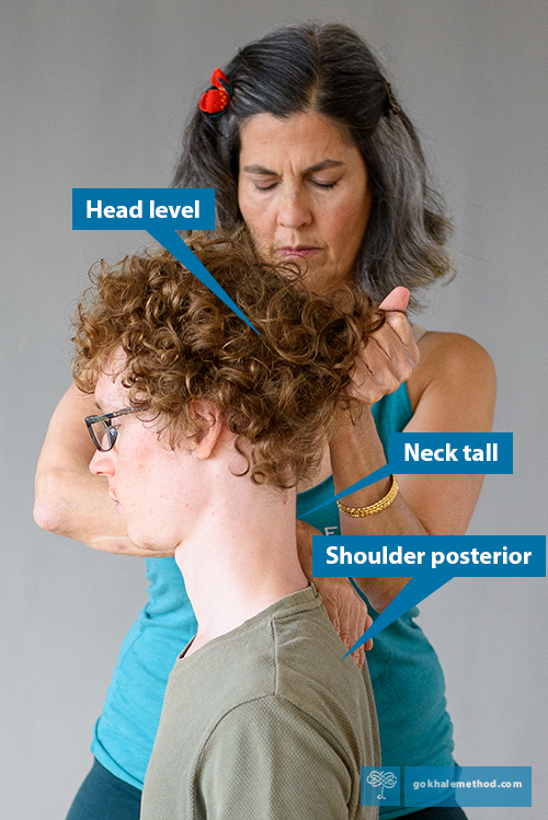 Esther Gokhale using hair pull technique with a young male student.