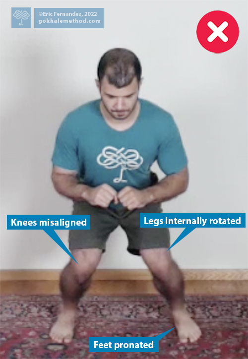 Gokhale Method teacher Eric Fernandez demonstrates a squat with poor form.