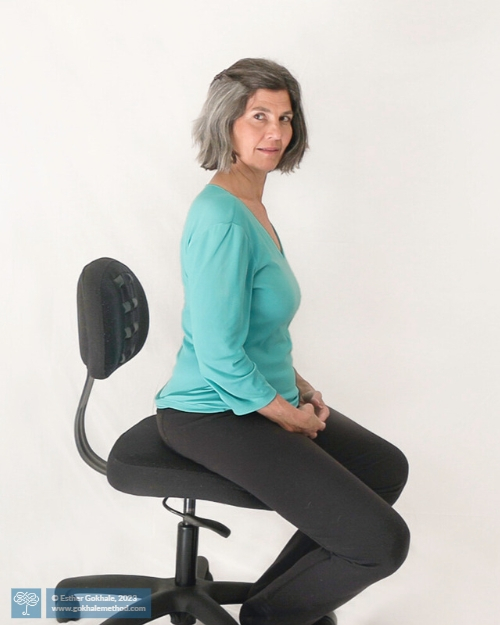 Esther Gokhale stacksitting on a Gokhale Pain-Free Chair.
