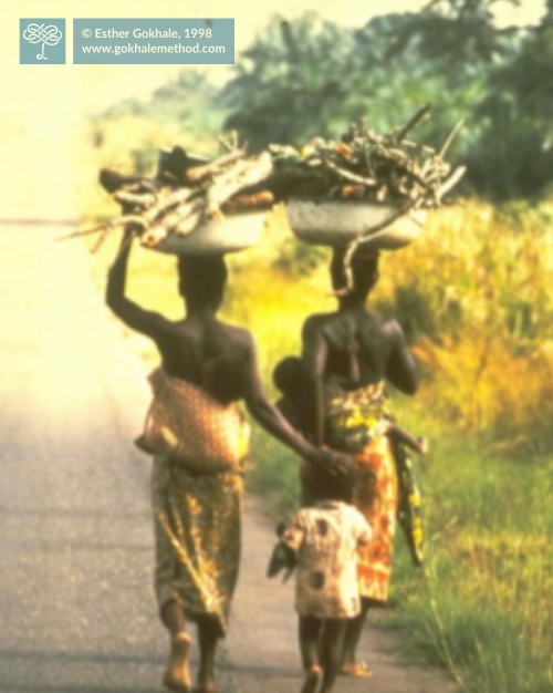 Women in Burkina Faso carrying large loads on their heads.