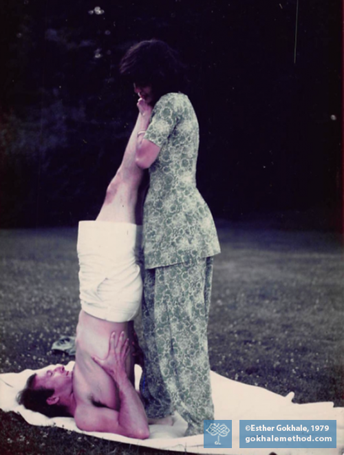 Esther Gokhale with yoga student in shoulder stand.