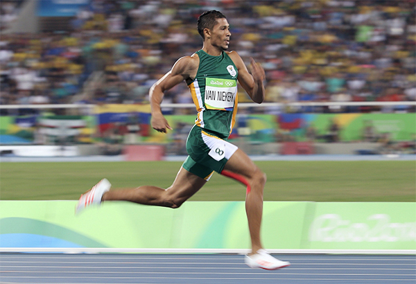 South African sprinter Wayde van Niekerk running, side view
