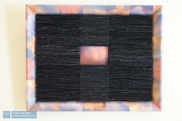 Julia Rabin’s artwork, black paper on sky photos on tissue frame.