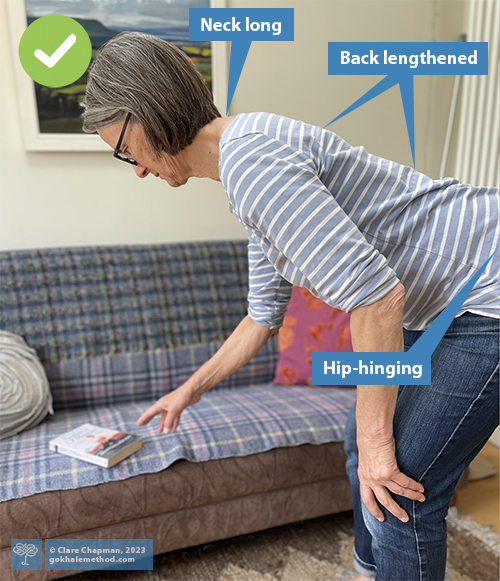 Woman hip-hinging, back and neck straight and parallel to floor, glasses staying in place.
