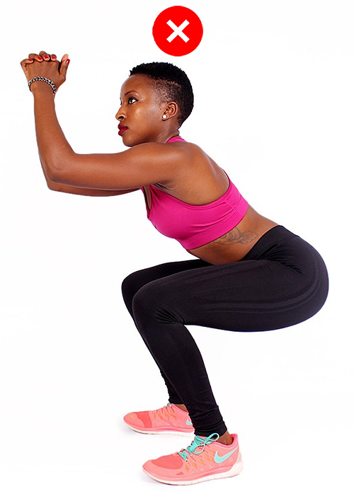 Person in partial squat from side lifting chin.