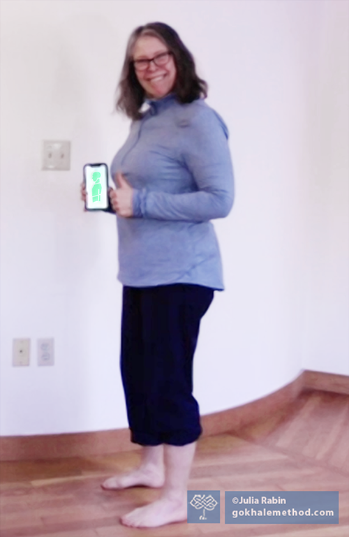 Julia Rabin standing with PostureTracker™.