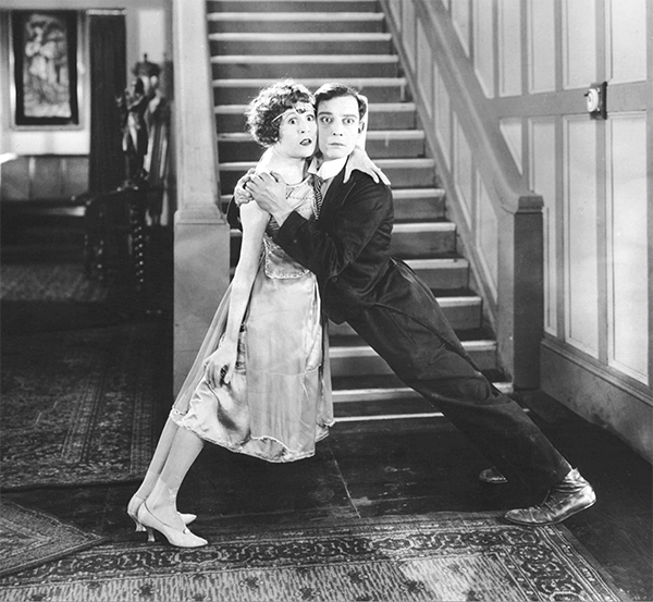 Virginia Fox and Buster Keaton prop each other up in The Electric House (1922).