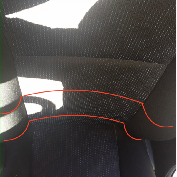 Car seat close-up with red line horizontal curvature